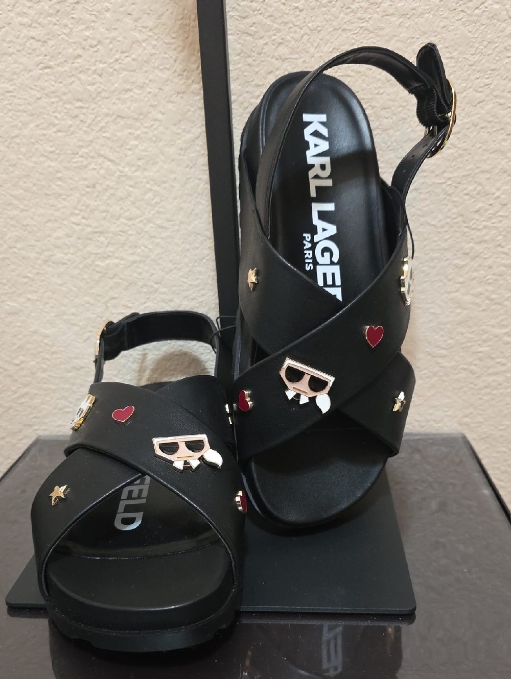 Karl Lagerfeld Black Crisscross Charm Sandals with Gold Accents